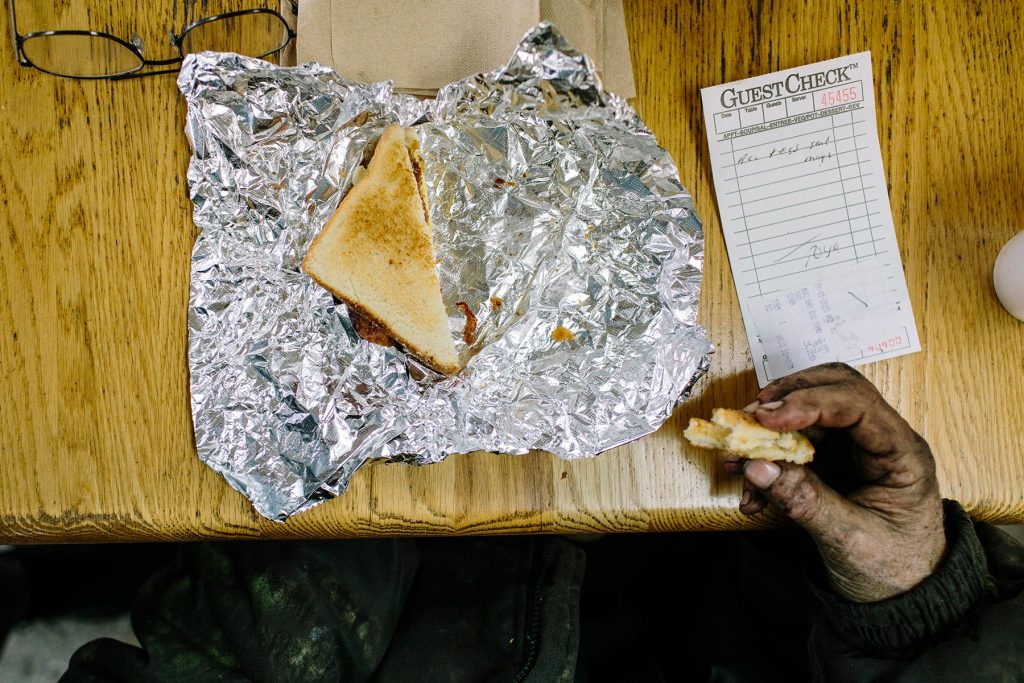 Kewanee, MS - 4/1/2015 - Robert Harsell sits for a quick lunch at a small rural truck stop on the border of Mississippi and Alabama. Robert Harsell (68) is part of a dwindling population of independent owner/operators in an economy that is steadily becoming more corporate. He feels that new safety regulations threaten their livelihood, and actually make highways more dangerous.